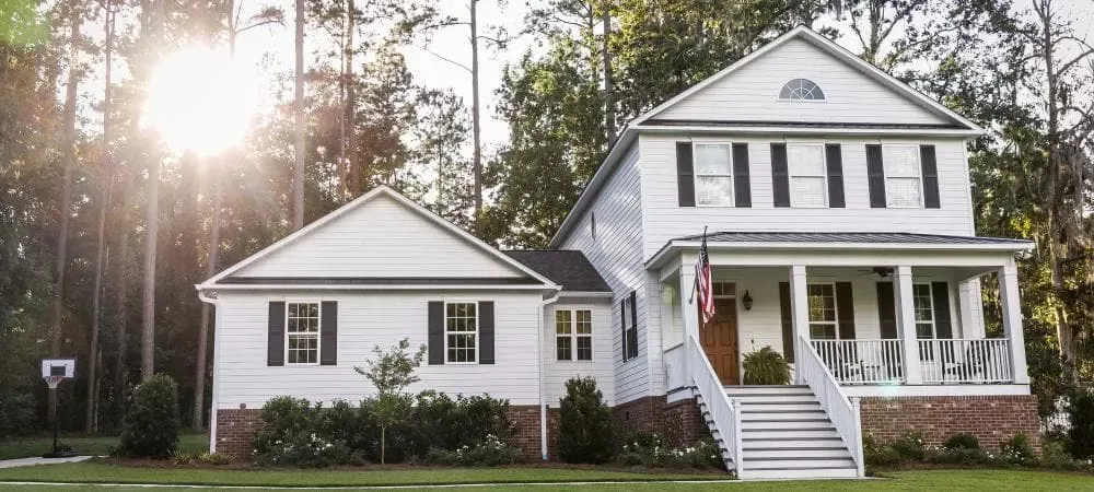 White house with a beautiful yard